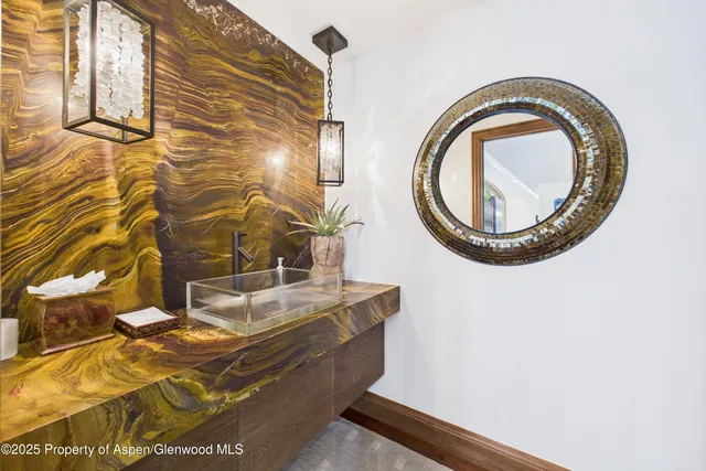 a bathroom with a sink and a mirror