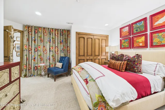 a bed room with a bed and a couch