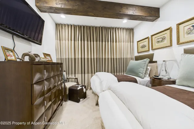 a living room with furniture a couch and a stove