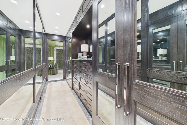 a lobby with furniture and floor to ceiling window