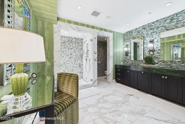 a bathroom with a double vanity sink and a mirror