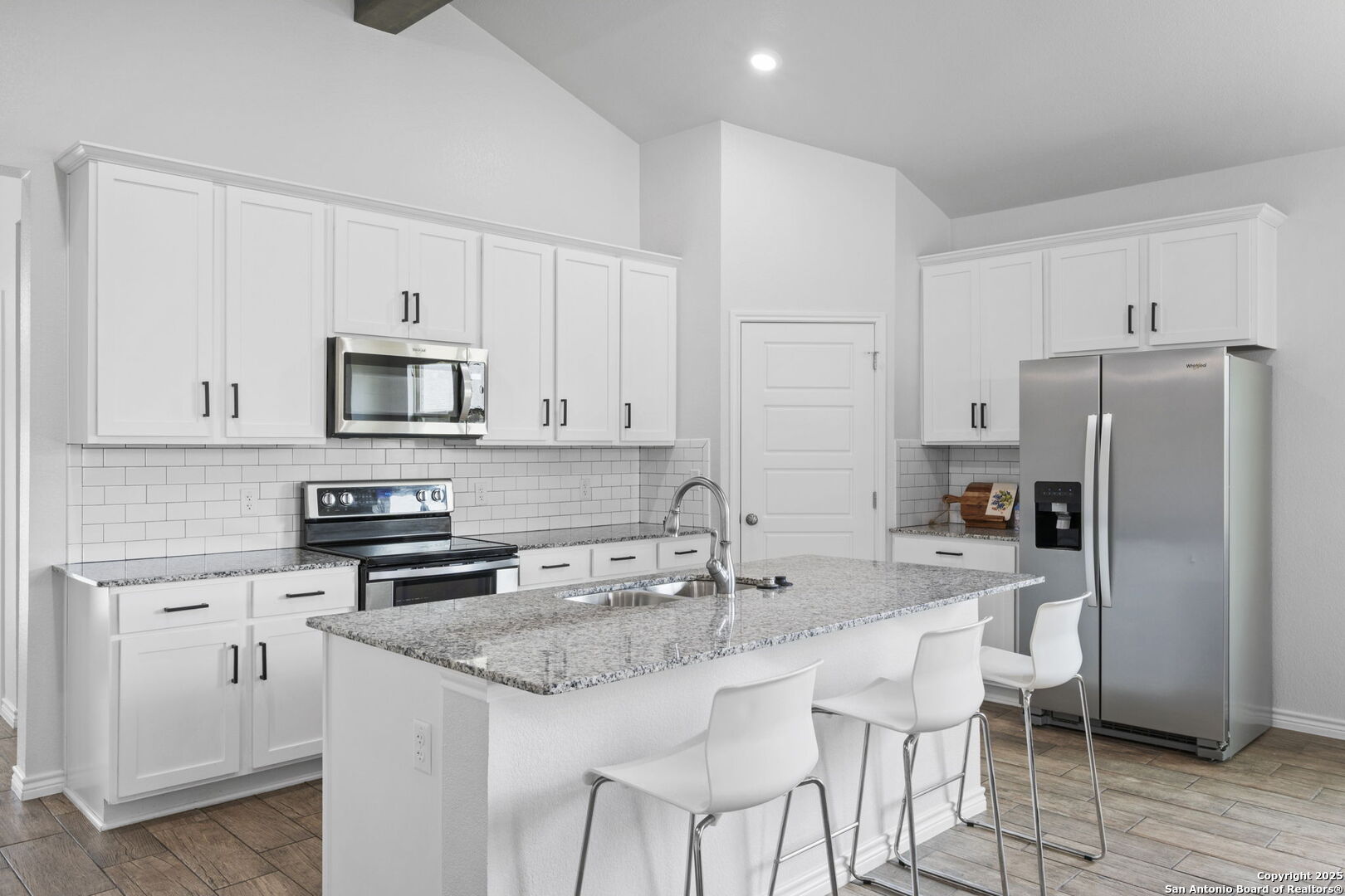 6110 Salerno Street Temple, TX 76502 - Photo 15 of 44 a kitchen with stainless steel appliances granite countertop a white cabinets and a refrigerator