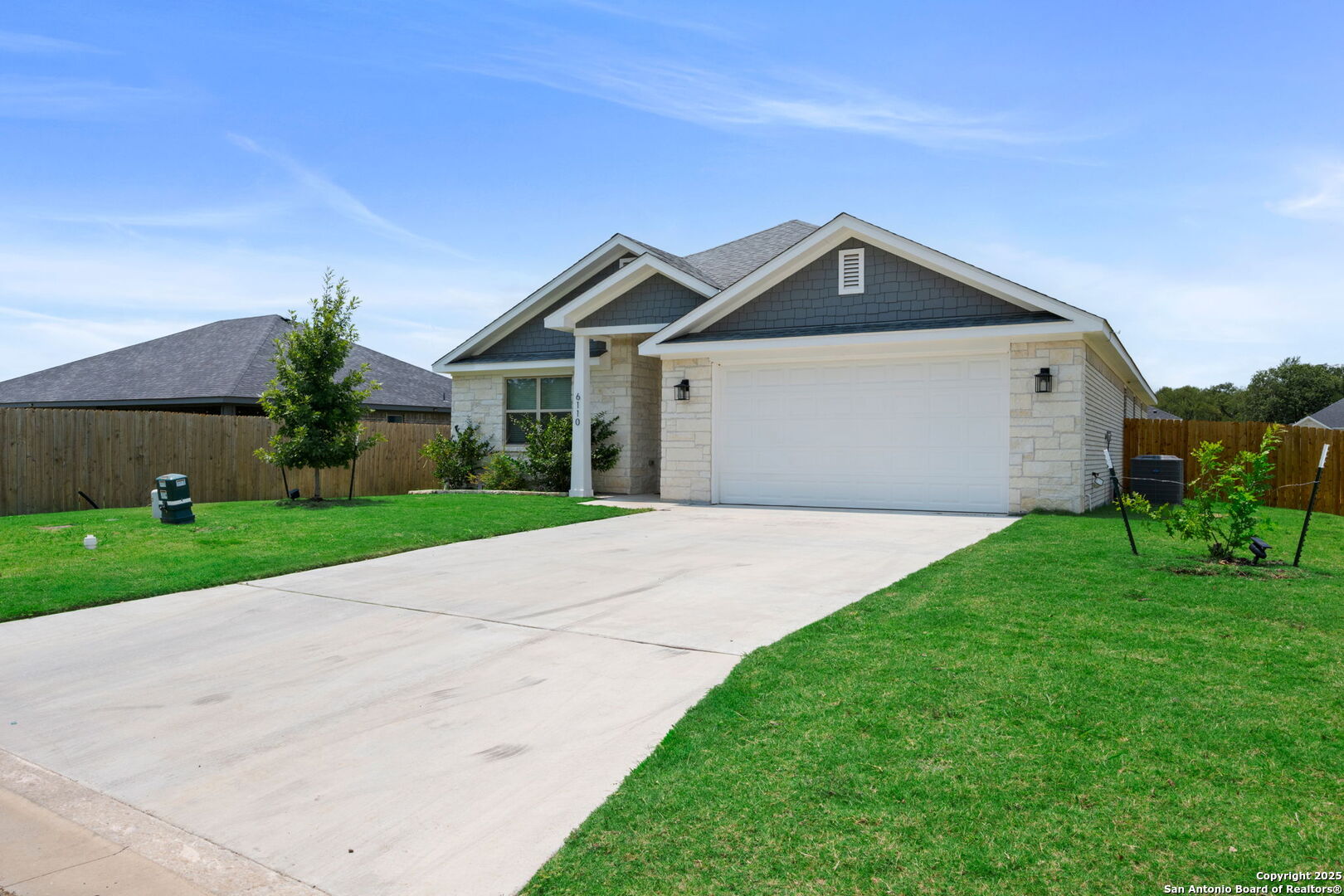 6110 Salerno Street Temple, TX 76502 - Photo 2 of 44 a front view of a house with a yard and garage