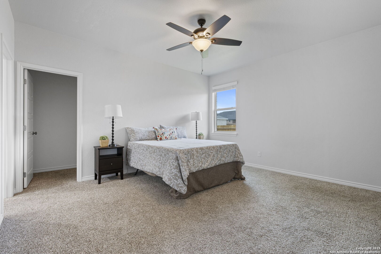6110 Salerno Street Temple, TX 76502 - Photo 31 of 44 a bedroom with a bed chandelier and a ceiling fan