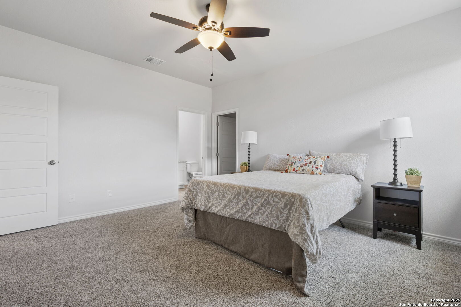 6110 Salerno Street Temple, TX 76502 - Photo 32 of 44 a bedroom with a bed and a chandelier