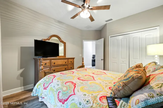 a kitchen with stainless steel appliances kitchen island granite countertop a table and chairs in it