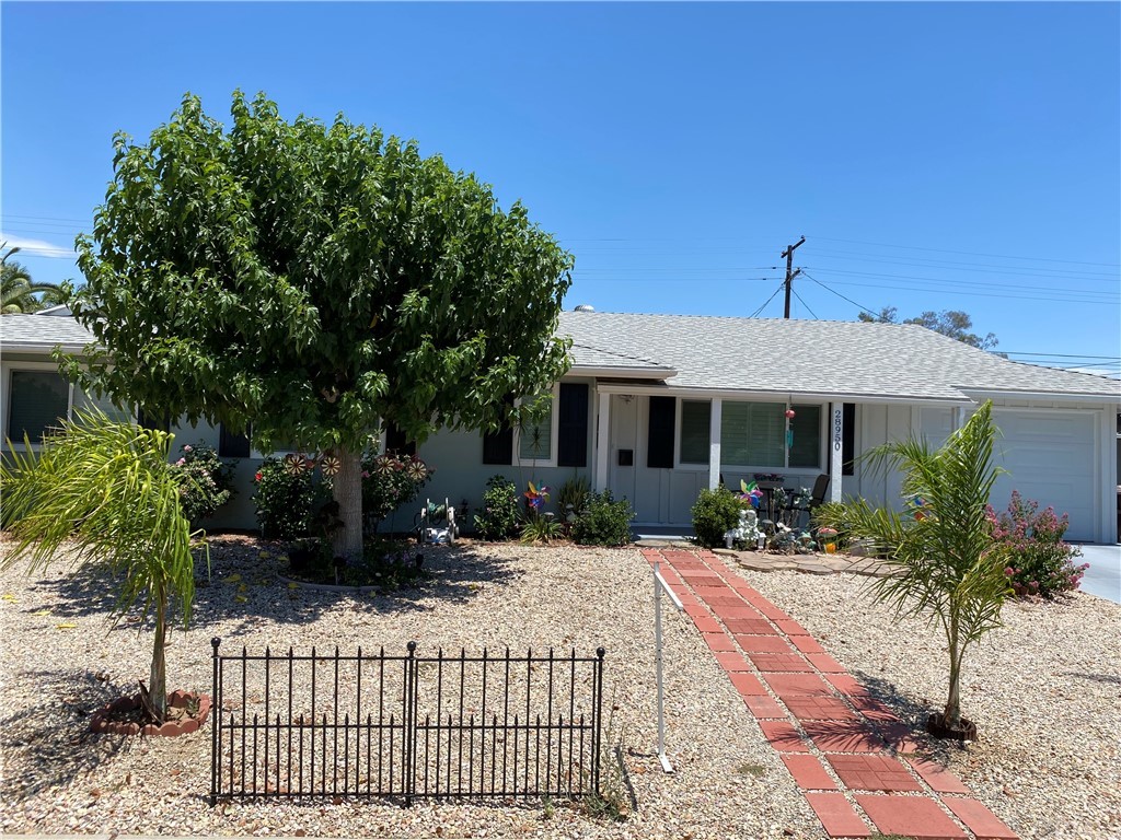 28950 Pebble Beach Drive Menifee, CA 92586 - Photo 1 of 18 a front view of house with yard outdoor seating and barbeque oven