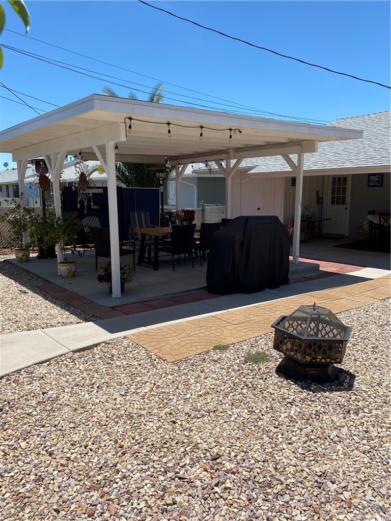 28950 Pebble Beach Drive Menifee, CA 92586 - Photo 17 of 18 a living room with a couch and a fireplace