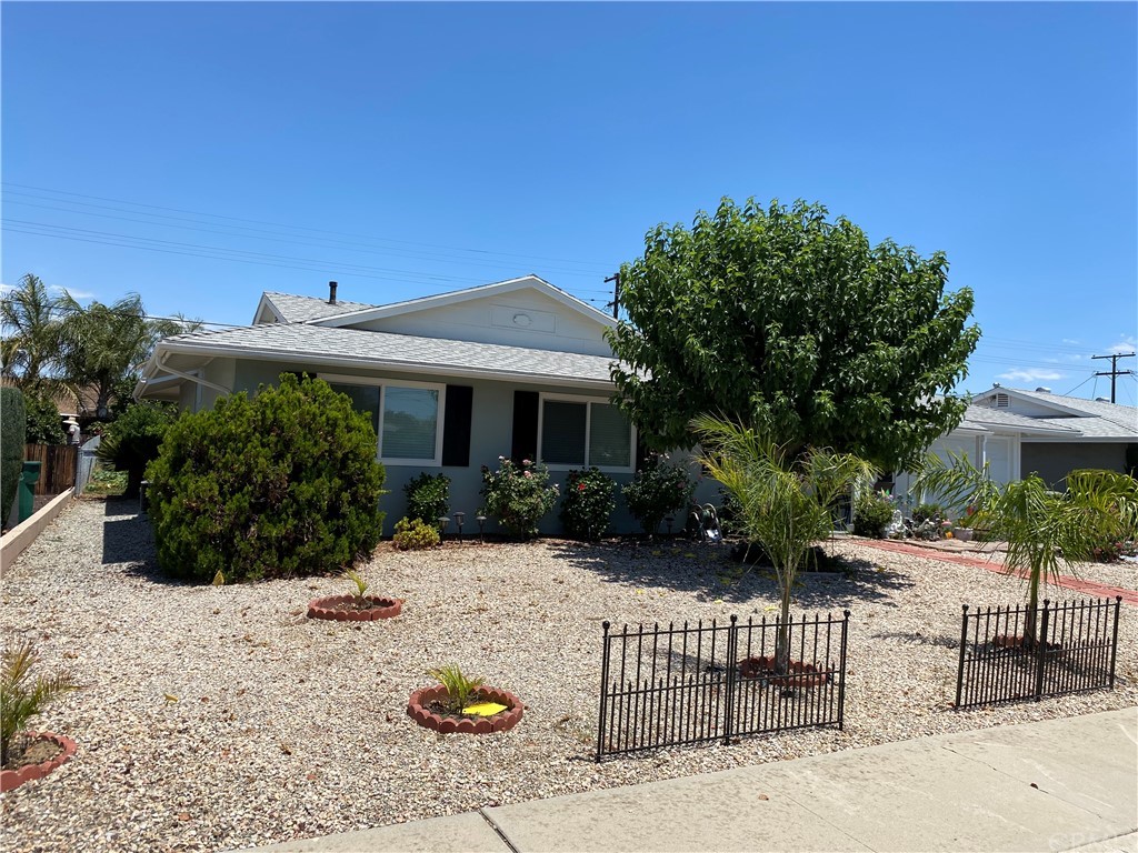 28950 Pebble Beach Drive Menifee, CA 92586 - Photo 2 of 18 a front view of a house with a yard