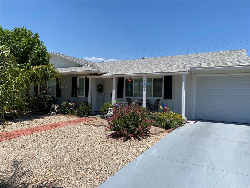28950 Pebble Beach Drive Menifee, CA 92586 - Photo 3 of 18 front view of a house with a yard