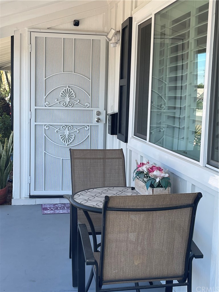 28950 Pebble Beach Drive Menifee, CA 92586 - Photo 4 of 18 a view of a dining room with furniture and a chandelier