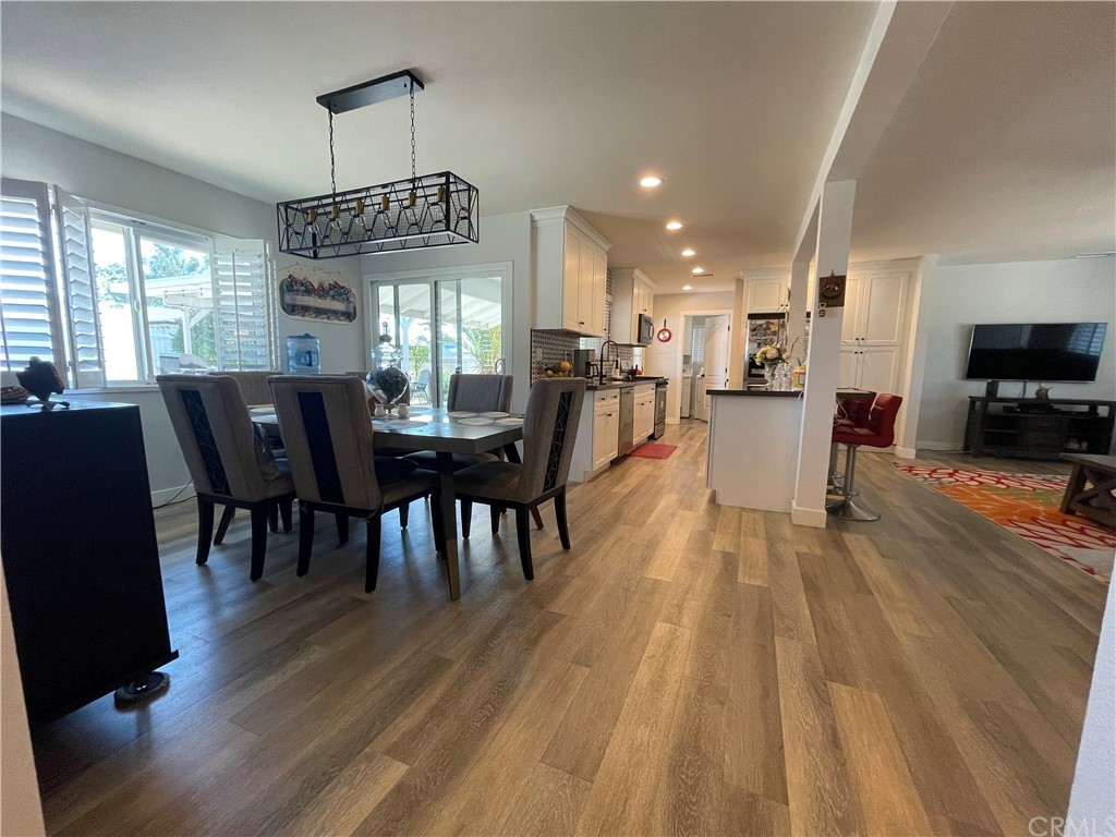 28950 Pebble Beach Drive Menifee, CA 92586 - Photo 5 of 18 a view of a dining room with furniture window and wooden floor