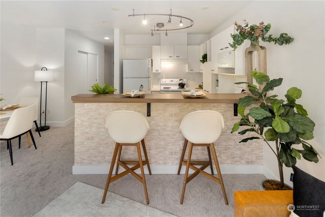 a view of a kitchen and dining room