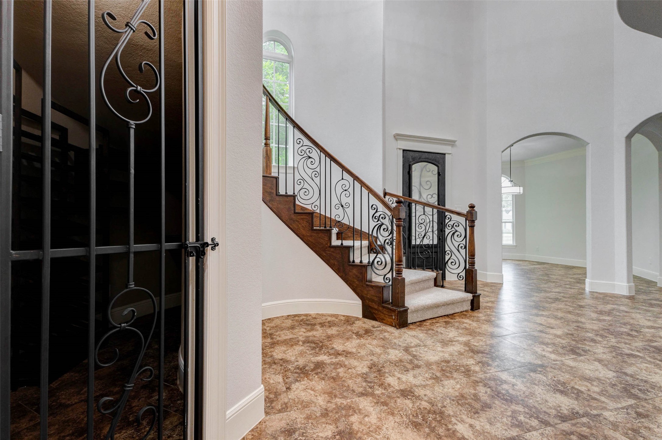 5327 Whitmore Fulshear, TX 77441 - Photo 11 of 50 Tucked discreetly beneath the staircase, the custom wine room provides dedicated storage for your collection while adding a distinctive architectural feature to the home.