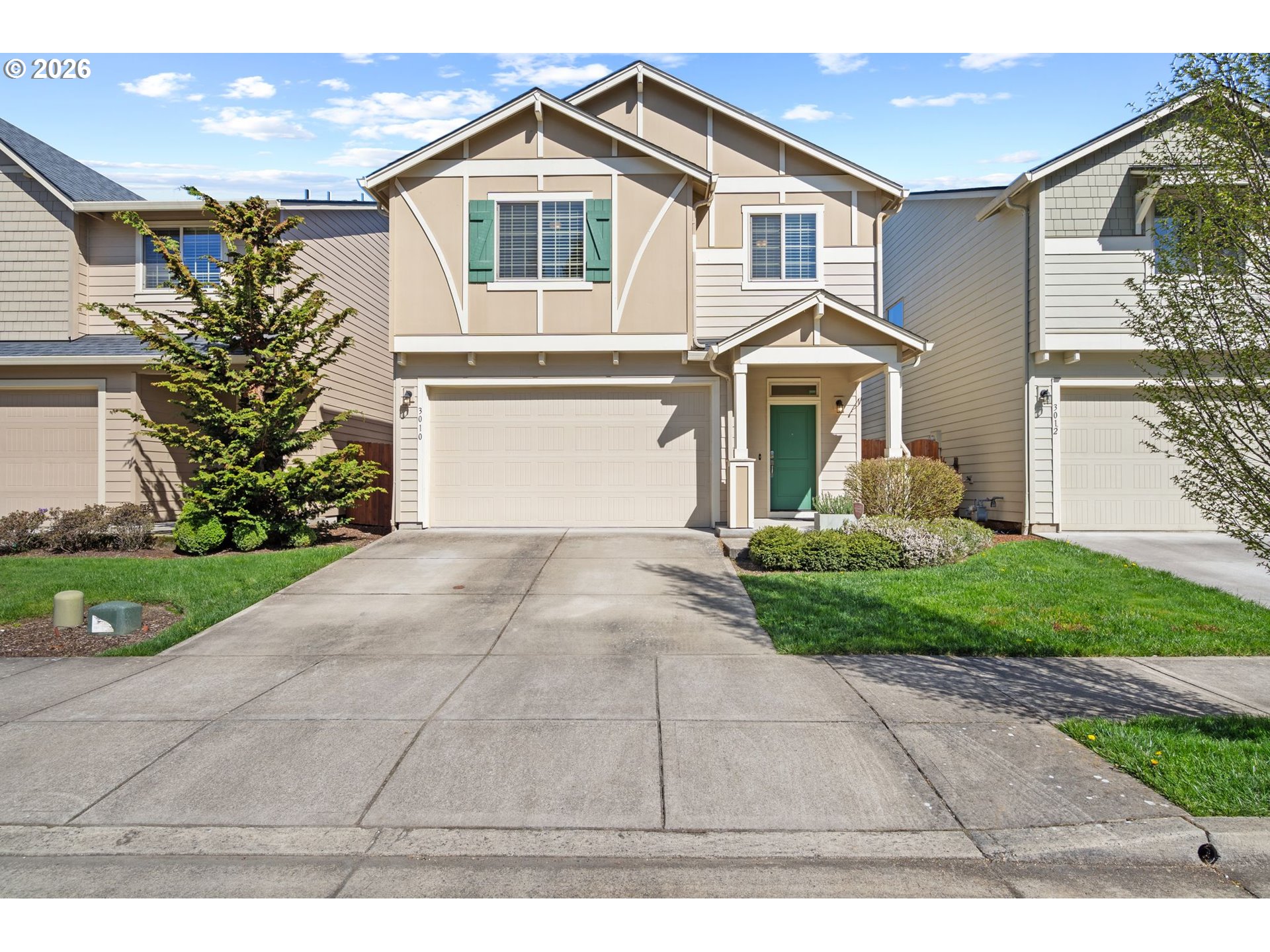 3010 Northeast 74th Street Vancouver, WA 98665 - Photo 2 of 39 a front view of a house with a yard and garage