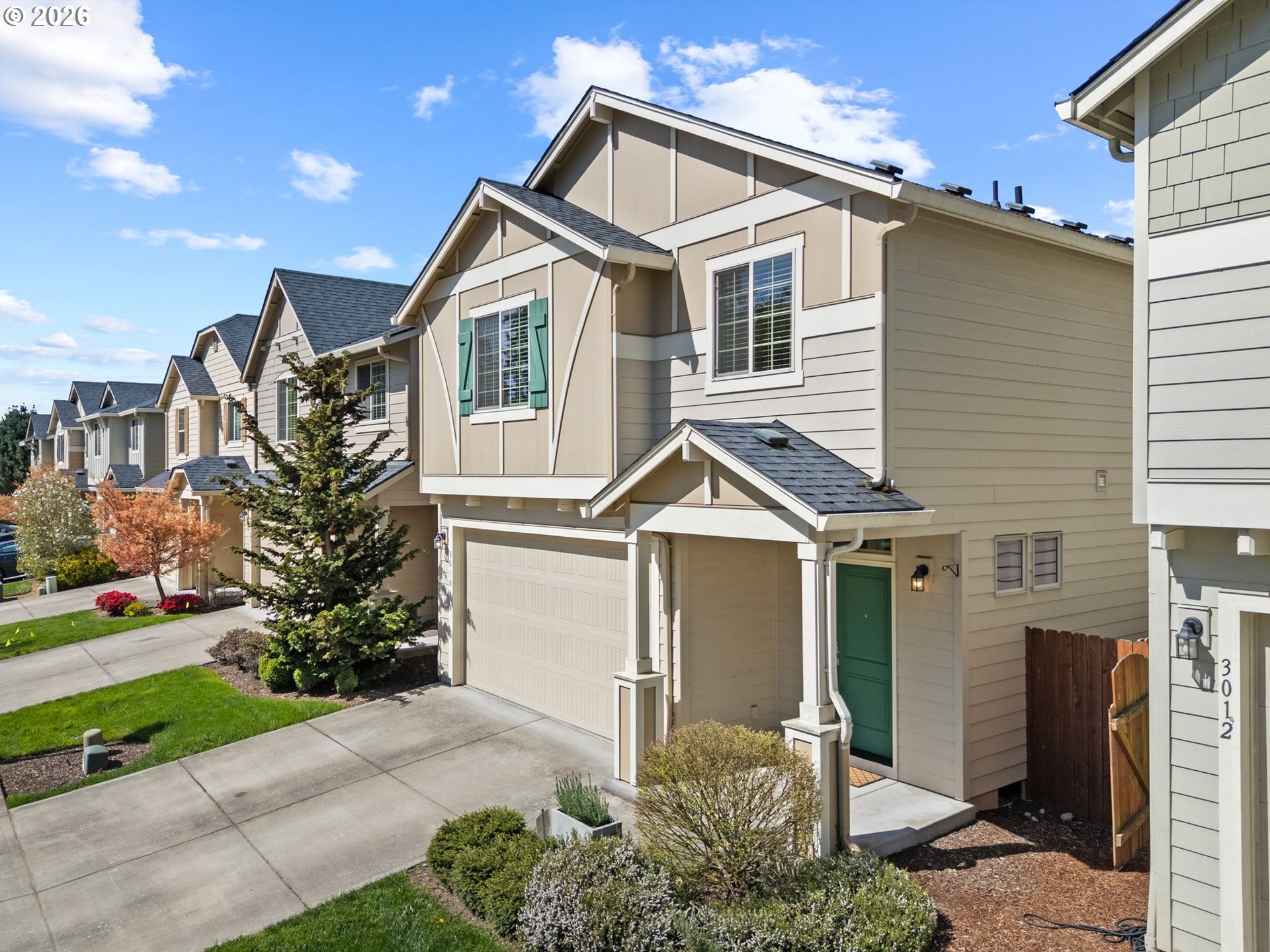 3010 Northeast 74th Street Vancouver, WA 98665 - Photo 3 of 39 a front view of a house with a yard and potted plants