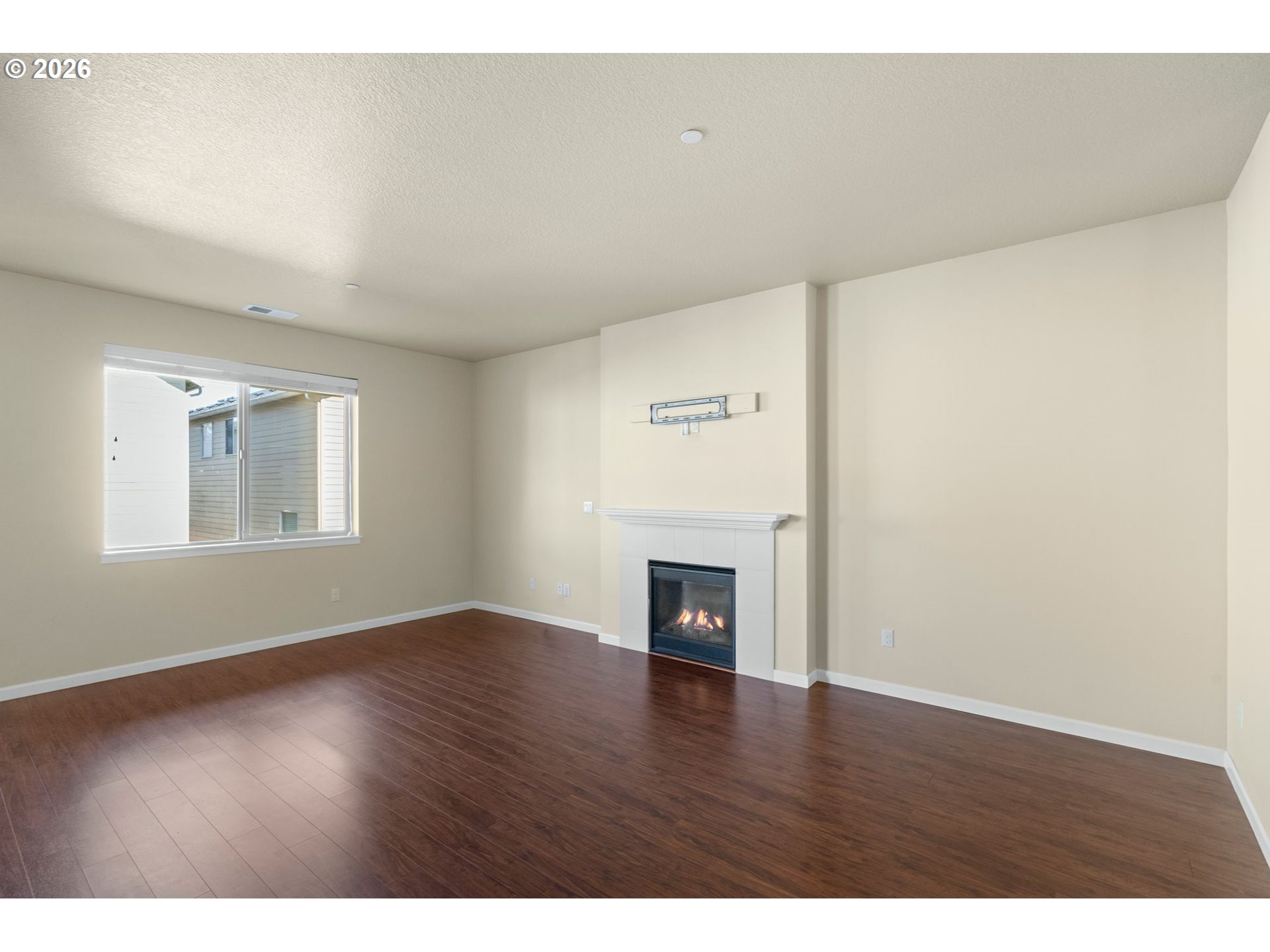 3010 Northeast 74th Street Vancouver, WA 98665 - Photo 10 of 39 a view of an empty room with wooden floor and a window