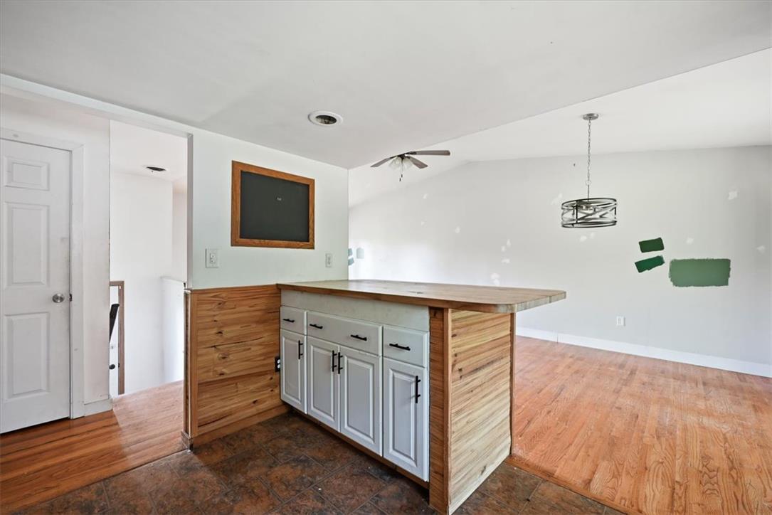 9870 North Delaware Drive Bangor, PA 18013 - Photo 20 of 62 Gleaming hardwood floors and a wood-wrapped breakfast bar anchor this versatile open-concept living space.