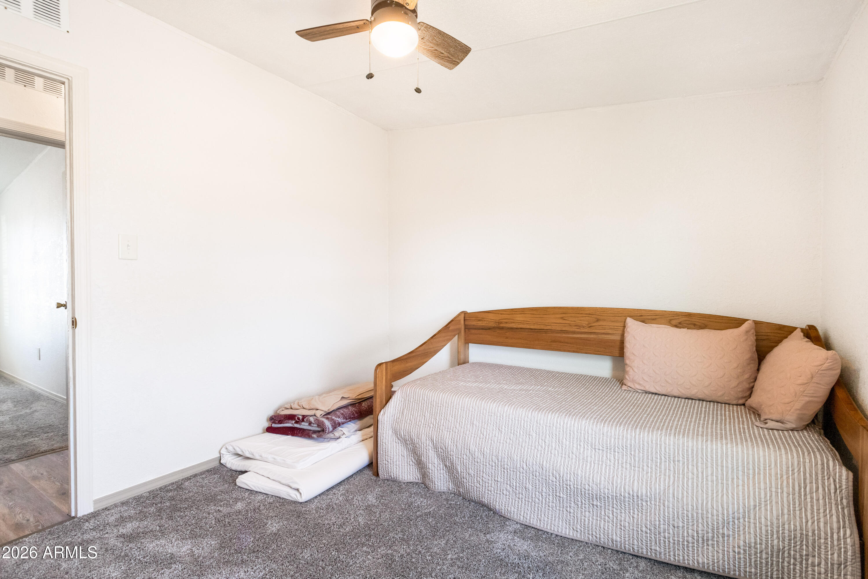 10405 North Mormon Road Elfrida, AZ 85610 - Photo 25 of 43 a bedroom with a bed and lamp
