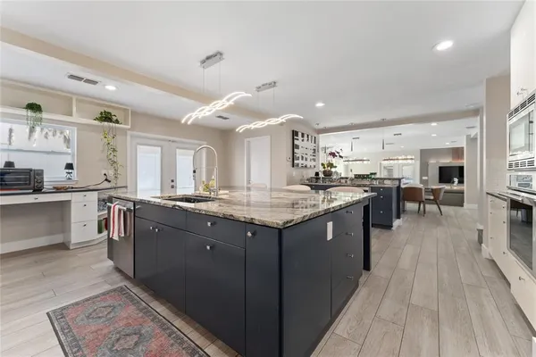 a kitchen with a sink and cabinets