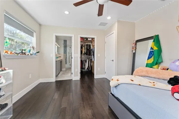 a bathroom with a sink a large mirror and a shower