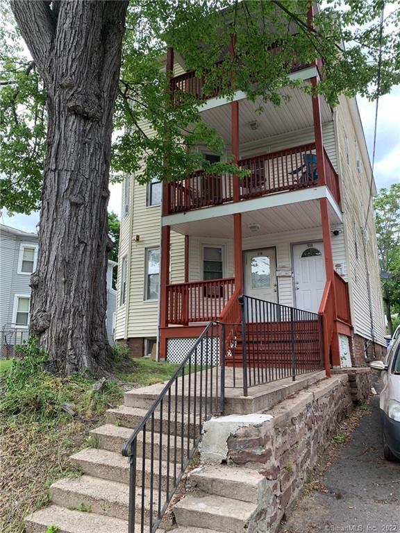 314 Capen Street Hartford, CT 06112 - Photo 1 of 1 a view of a house with a small yard and a large tree