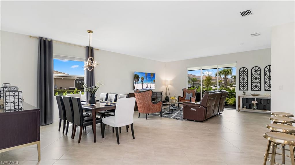 2425 Orchard Street Naples, FL 34120 - Photo 20 of 28 a living room with fireplace furniture and a large window