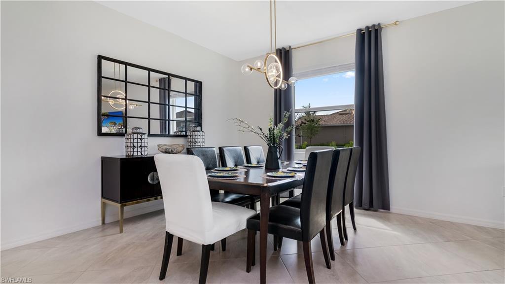 2425 Orchard Street Naples, FL 34120 - Photo 21 of 28 a view of a dining room with furniture and window