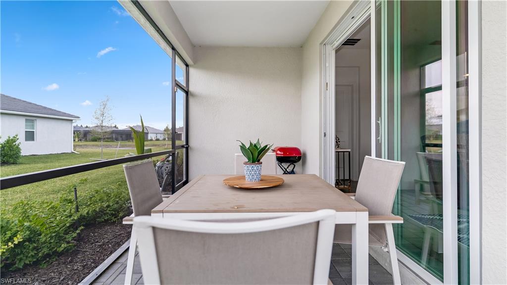 2425 Orchard Street Naples, FL 34120 - Photo 23 of 28 a view of a dining room with furniture and a potted plant