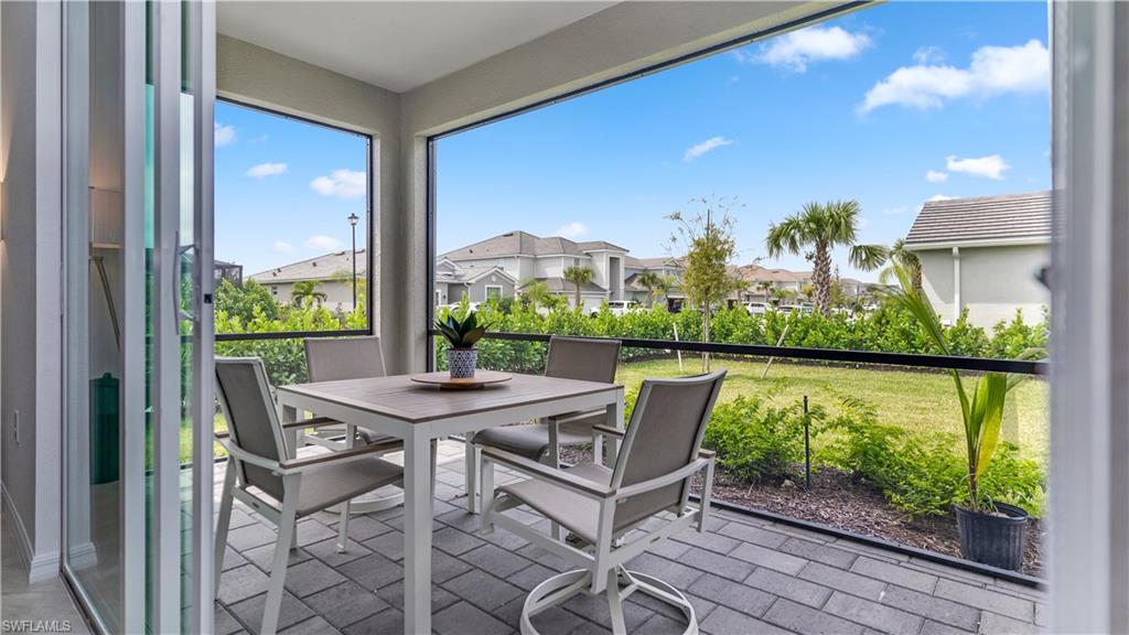 2425 Orchard Street Naples, FL 34120 - Photo 9 of 28 a view of an chairs and table in the balcony