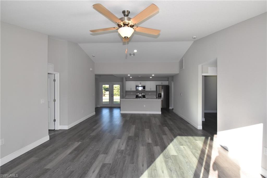 202 Seagrape Street Port Charlotte, FL 33954 - Photo 6 of 21 a view of a livingroom with a window and wooden floor