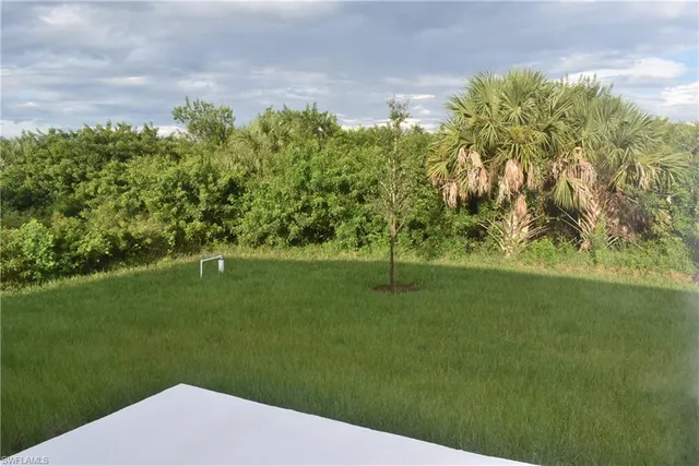 a view of a golf course with a lake