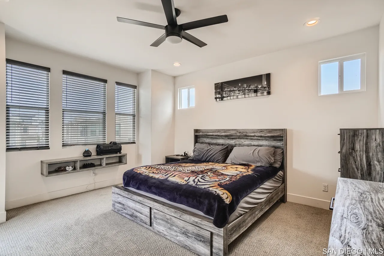 2110 Element Way Chula Vista, CA 91915 - Photo 20 of 33 a bedroom with a bed a couch and a window