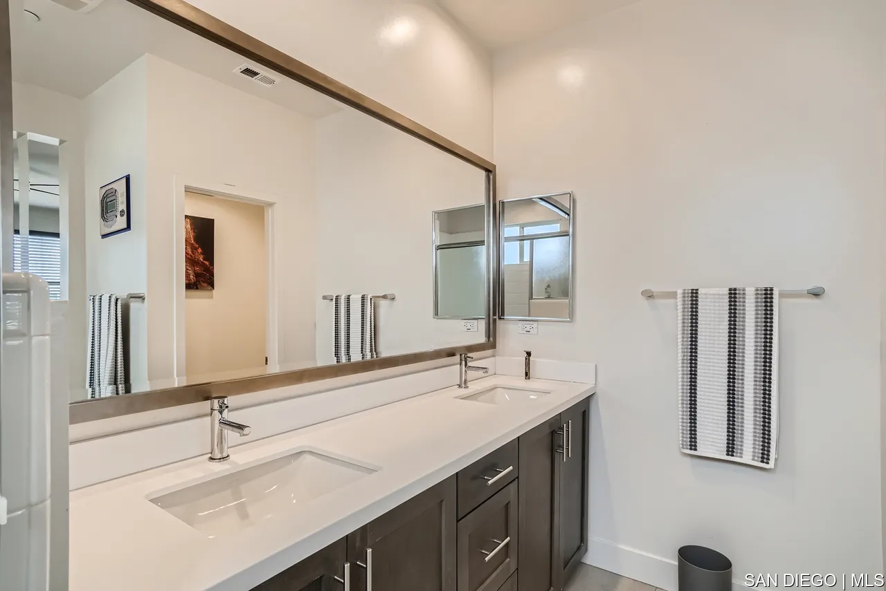 2110 Element Way Chula Vista, CA 91915 - Photo 24 of 33 a bathroom with a double vanity sink and a mirror