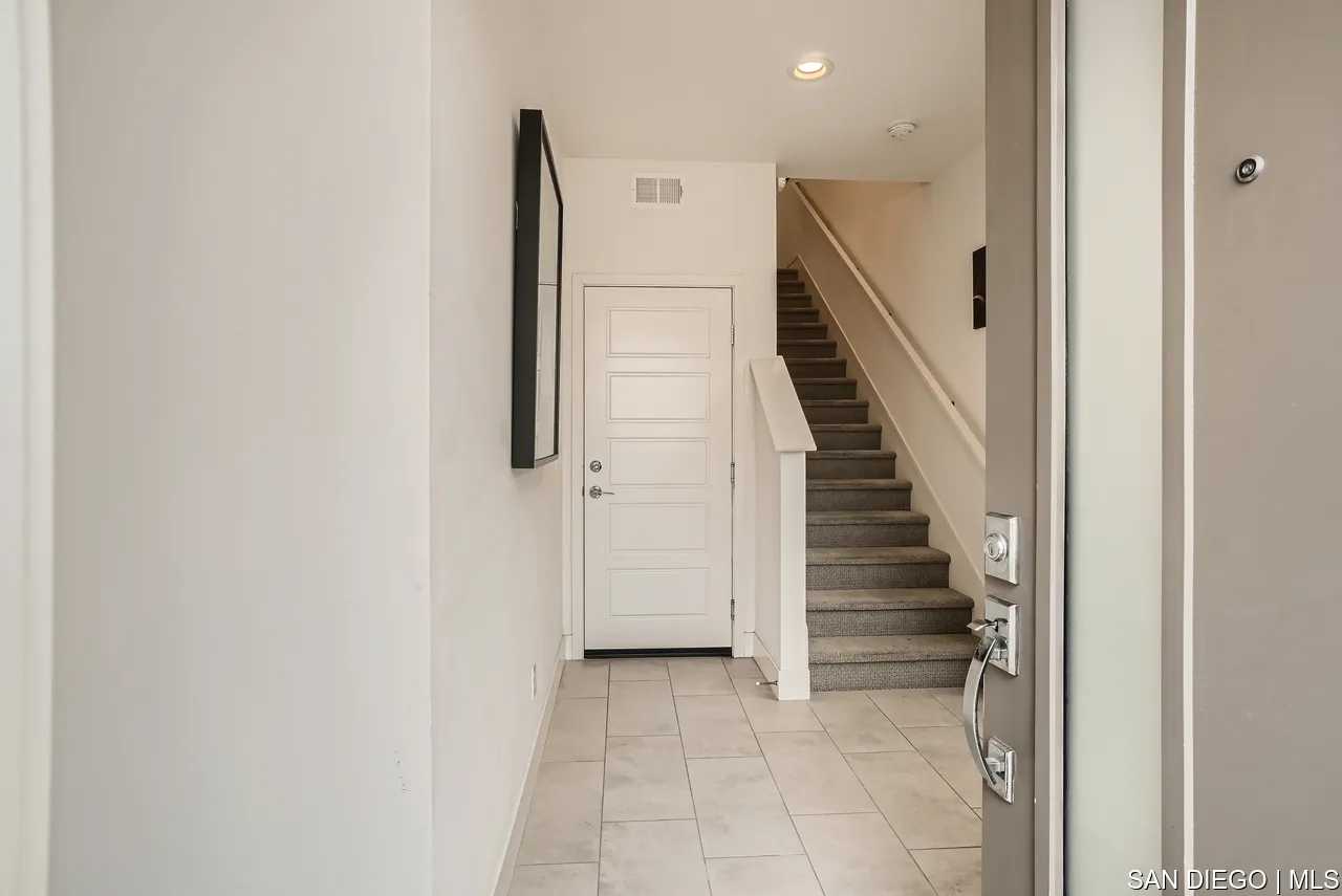 2110 Element Way Chula Vista, CA 91915 - Photo 5 of 33 a view of entryway and hall with wooden floor