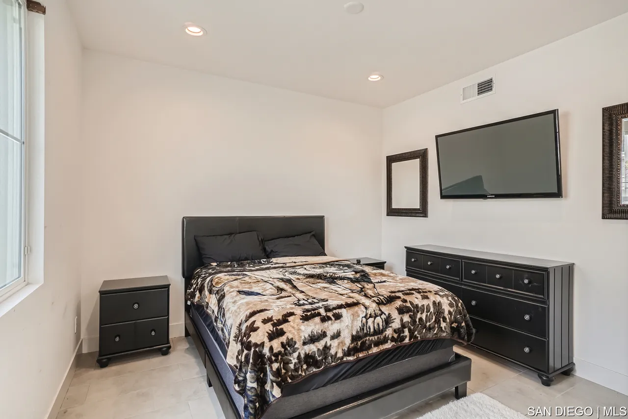 2110 Element Way Chula Vista, CA 91915 - Photo 6 of 33 a bedroom with a bed and a flat screen tv