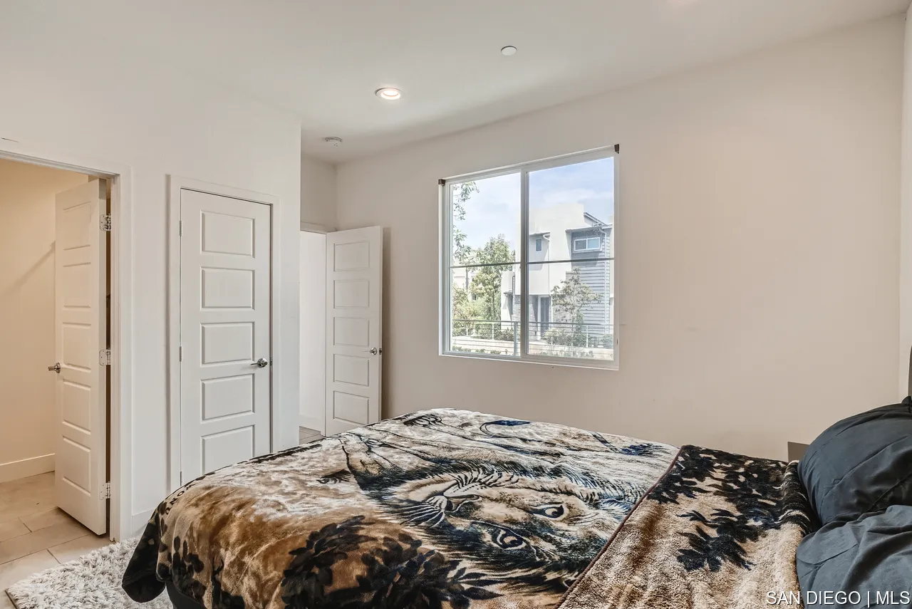 2110 Element Way Chula Vista, CA 91915 - Photo 7 of 33 a bedroom with a bed and a window