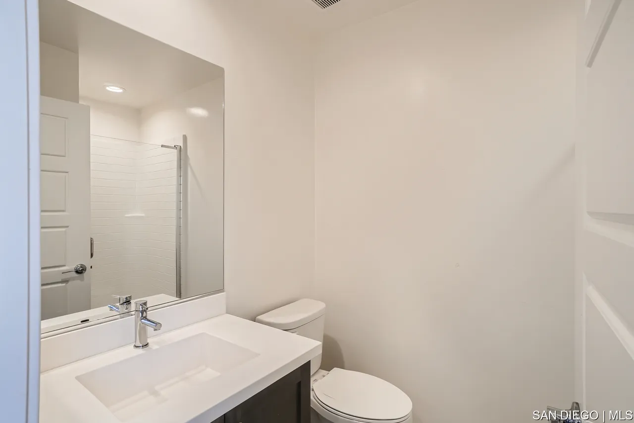 2110 Element Way Chula Vista, CA 91915 - Photo 8 of 33 a bathroom with a sink toilet and a mirror