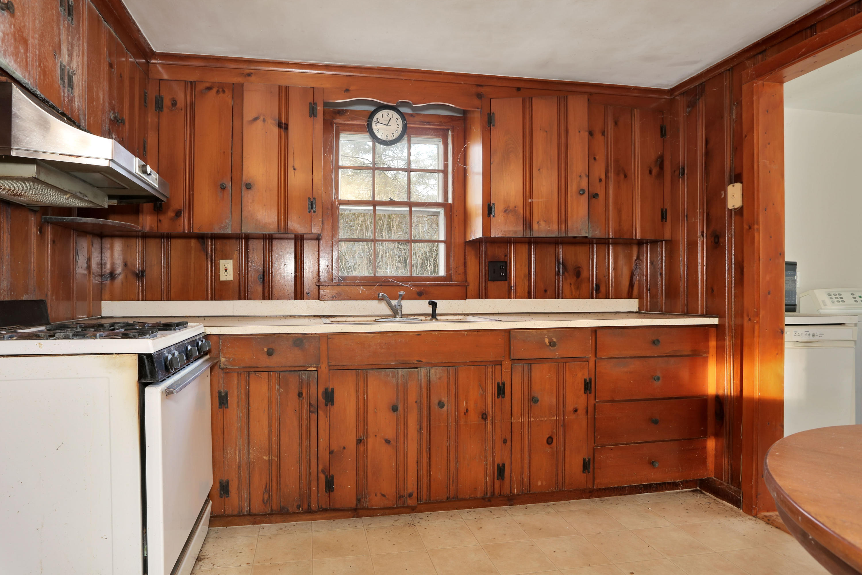 18 Menemsha Road Mashpee, MA 02649 - Photo 7 of 19 a kitchen with stainless steel appliances granite countertop a stove a sink and a refrigerator with wooden cabinets