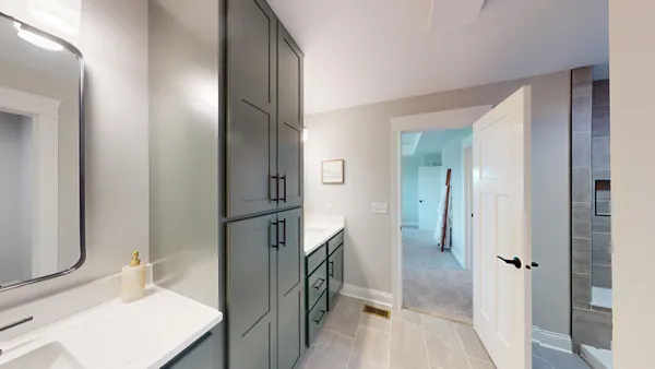 a kitchen with a refrigerator and a sink