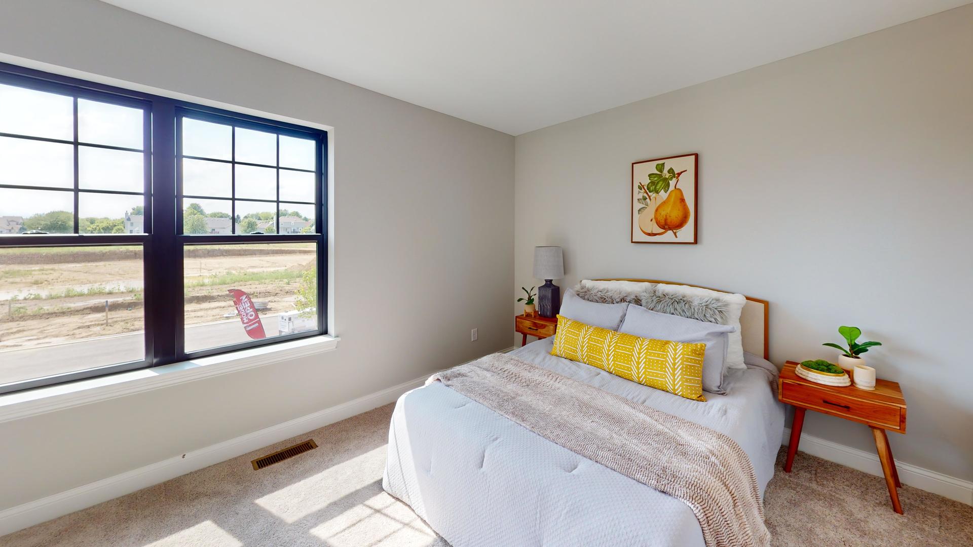 3S701 Deerpath Road North Aurora, IL 60542 - Photo 27 of 41 a bedroom with a bed and a window