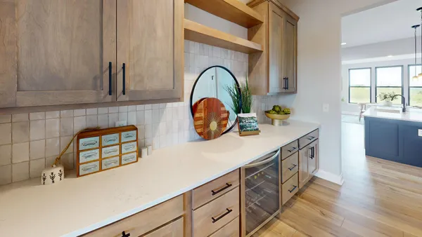 a kitchen with a sink cabinets and a wooden floor