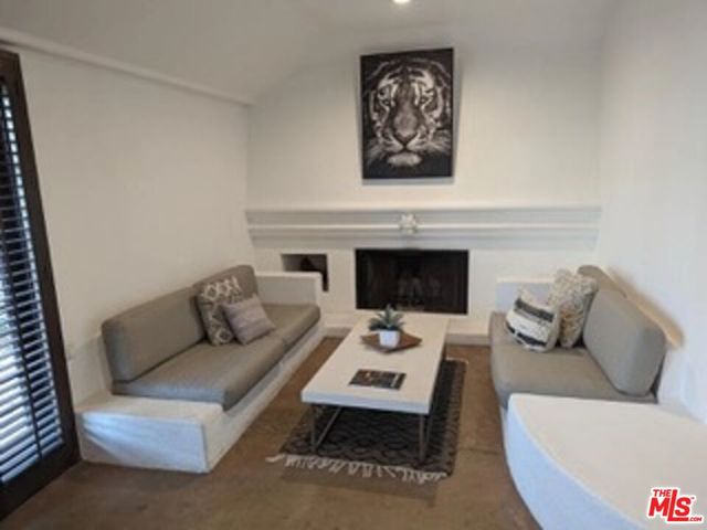 a view of livingroom with furniture and flat screen tv