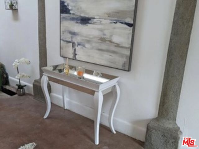 a view of a room with a wooden door