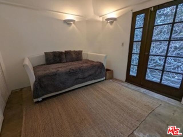 a bedroom with a bed and a table