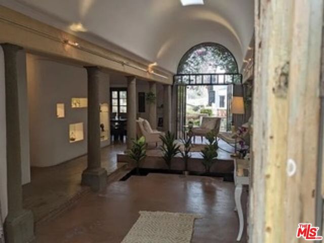 a view of hall way with furniture