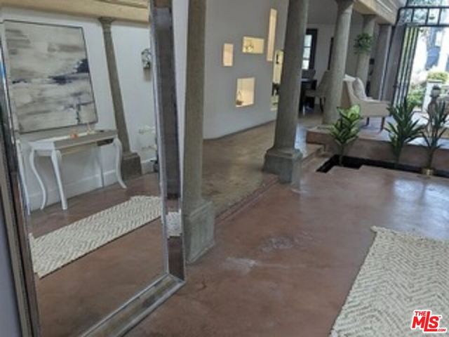 a view of a room with furniture and window