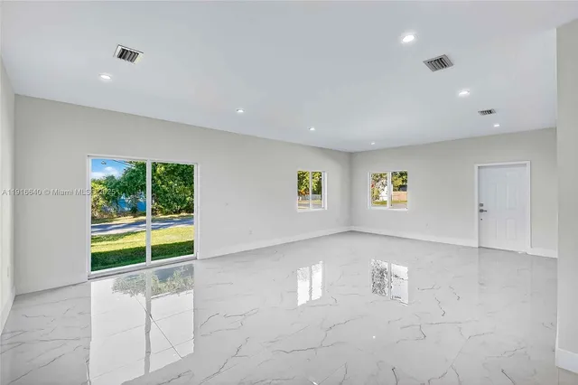 an empty room with windows