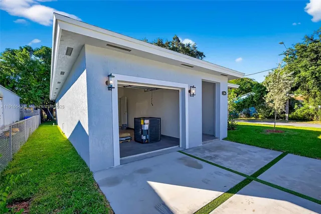 an aerial view of a houses and city street