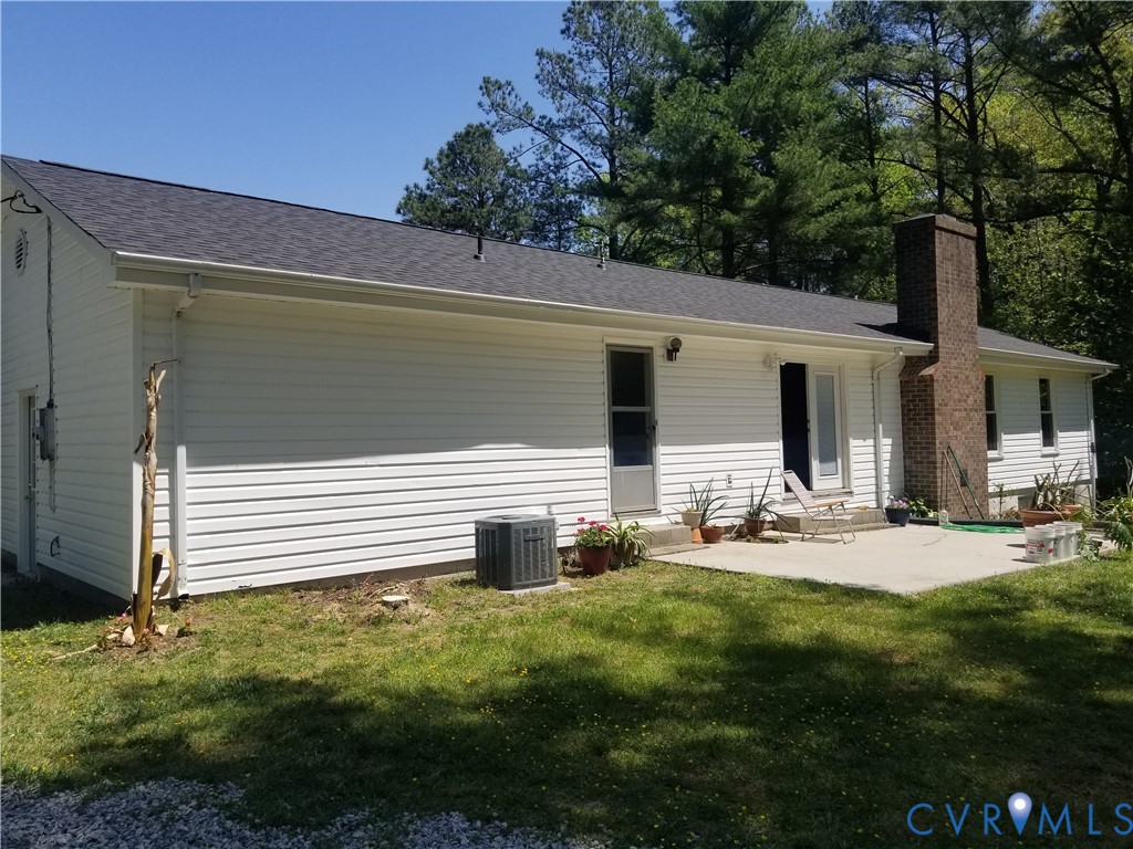 22417 Cox Road Sutherland, VA 23885 - Photo 21 of 22 a front view of house with yard and seating area